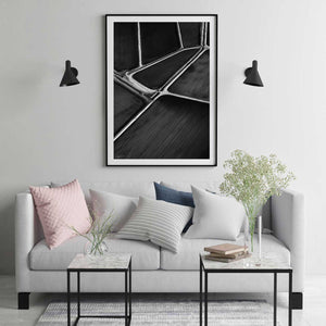 Black frame with white matt board black and white abstract print in modern room