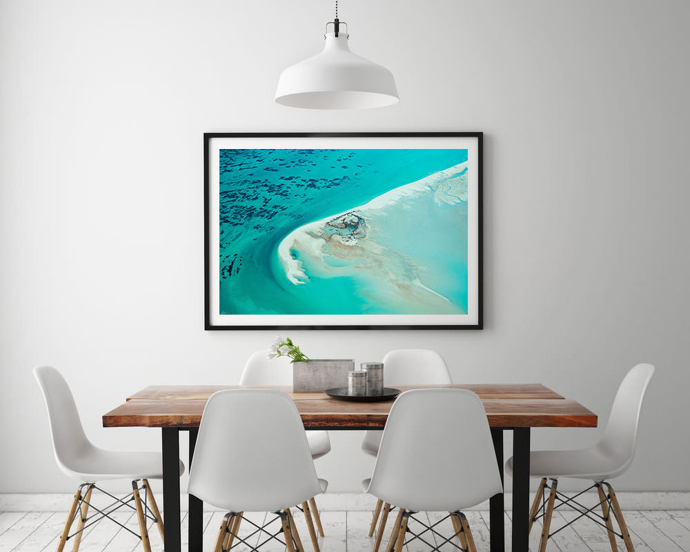 Abstract Aerial Art hanging on modern wall with black frame and turquoise colours
