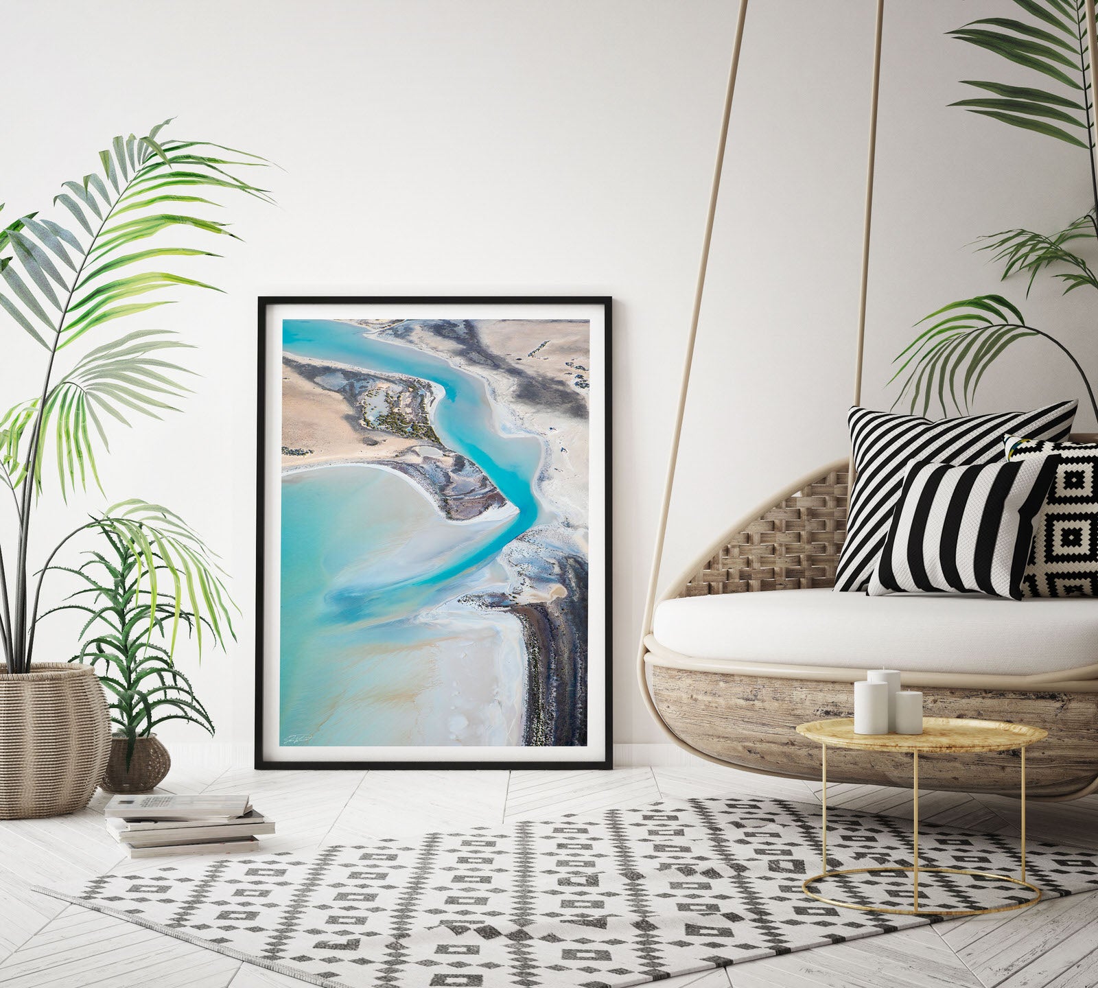 Pastel colour artwork in frame laying on wall with black frame and white matt board